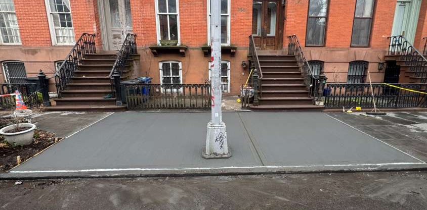 Complete sidewalk replacement in front of two townhouses