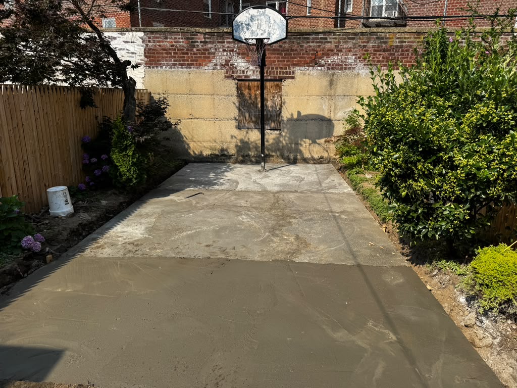 Freshly poured & leveled concrete for paver installation