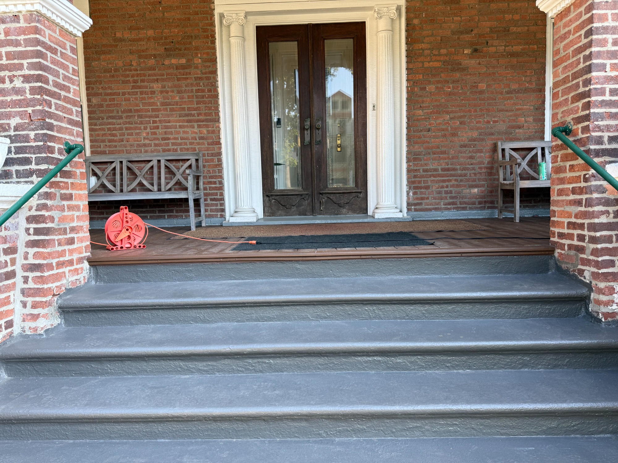 Repaired and coated masonry porch steps